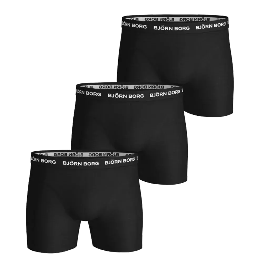 Tre-pak sorte Björn Borg boksershorts i et klassisk, enkelt design. De er tæt tilpassede med en elastisk talje prydet af det hvide Björn Borg-logo, som giver en stilren kontrast. Stoffet virker blødt og fleksibelt med god støtte til daglig brug og sport. En neutral og praktisk løsning for dem, der foretrækker komfort, holdbarhed og minimalistisk æstetik i undertøjet.