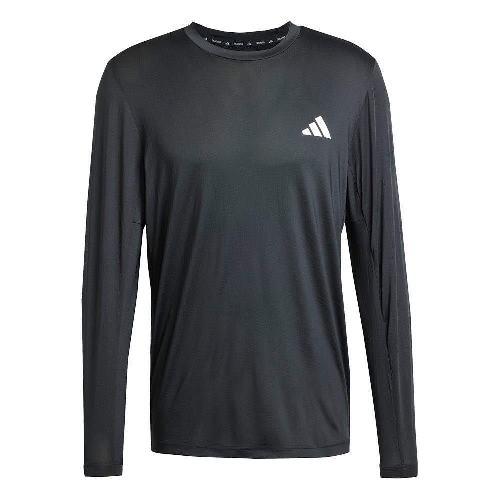 En enkel, sort langærmet træningsbluse med rund hals og slank pasform. Stoffet ser let og åndbart ud med en glat, fugttransporterende overflade, der egner sig til løb eller fitness. Et lille, hvidt logo på brystet tilfører et diskret sportspræg. Blusen fremstår minimalistisk og funktionel, nem at kombinere med træningsbukser eller hverdagstøj for et afdæmpet, atletisk look.