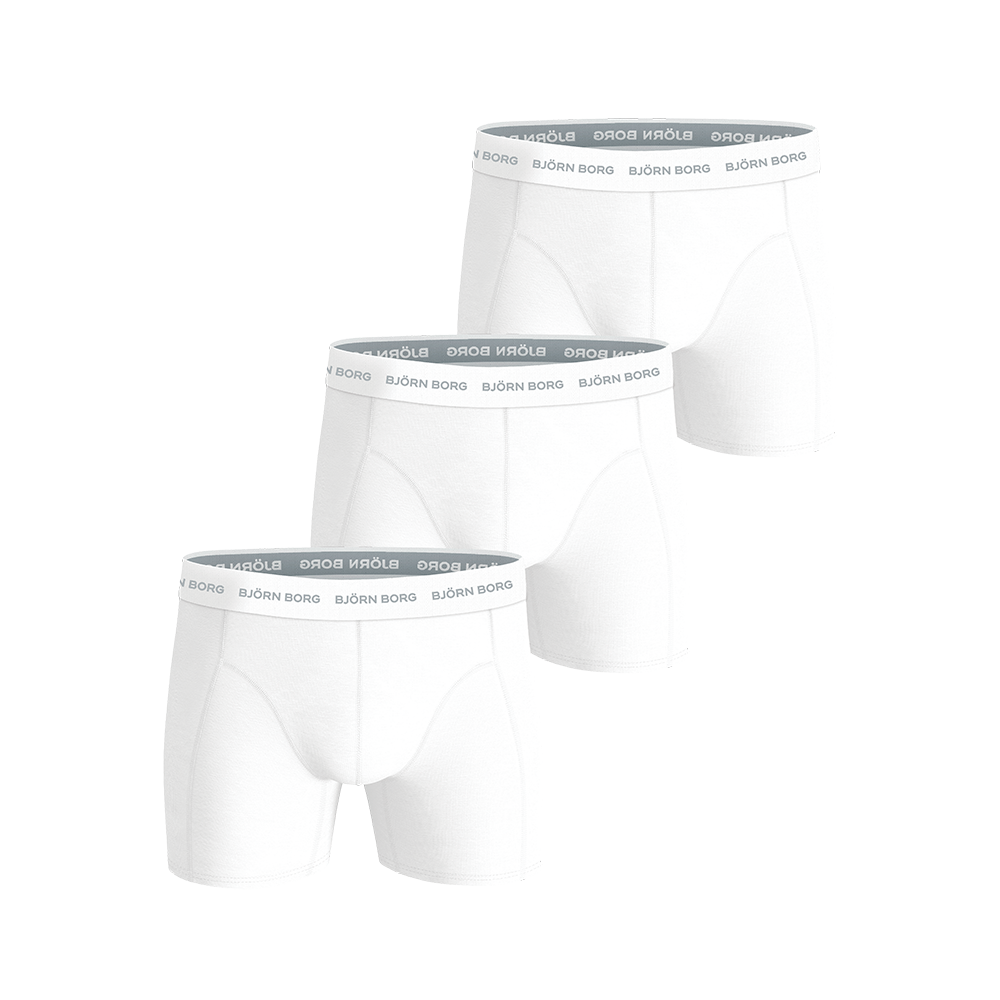 Et sæt på tre hvide boxershorts fra Björn Borg vises her. De har elastisk talje med gentaget logo, tætsiddende pasform og længere ben, hvilket giver komfort og støtte. Materialet fremstår blødt og åndbart, egnet til både hverdag og træning. Designet er enkelt og stilrent med diskrete syninger og et klassisk, tidløst udseende.