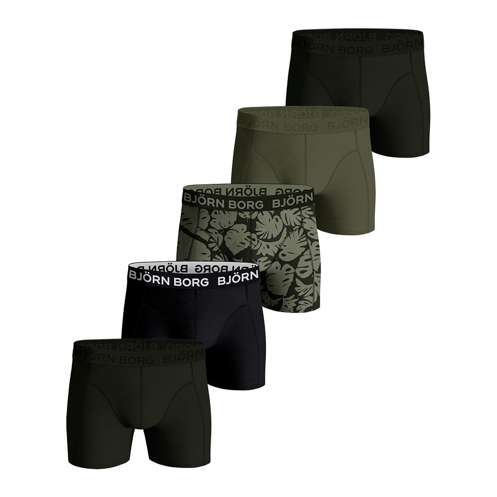 Fem-pak boxershorts i maskuline, dæmpede nuancer af olivengrøn og sort. Sættet består af ensfarvede modeller og én med bladprint, alle med bredt, elastisk taljebånd med BJÖRN BORG-logo. Designet er tæt siddende trunk-stil med flade syninger for komfort og bevægelsesfrihed. Et moderne, hverdagsorienteret valg til mænd, der søger en kombination af stil, funktion og holdbar pasform.