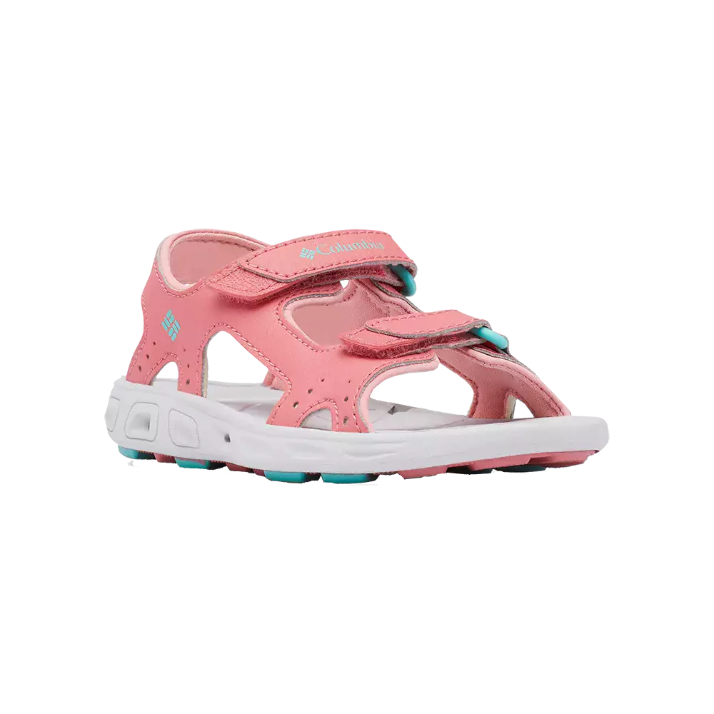Lyserøde børnesandaler fra Columbia med to justerbare velcrolukninger og åbent forfod-design. Skoen har blød, hvid mellemsål og en slidstærk sål med turkise detaljer for greb og komfort. Siderne er udført med luftige åbninger, hvilket giver god ventilation til varme dage. En praktisk, let og vandvenlig model, der passer til leg udendørs og sommeraktiviteter, samtidig med at den holder fødderne sikre og støttede.
