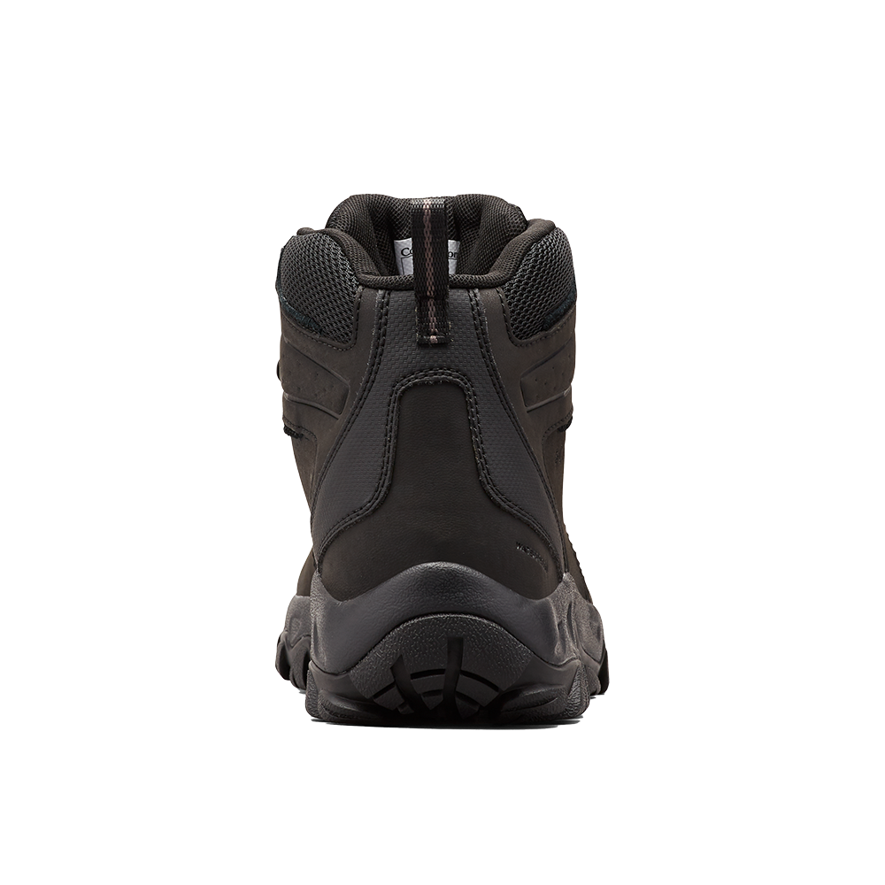 Et robust, sort vandretursstøvle set bagfra. Støvlen har en solid sål med dybt mønster for godt greb, polstret ankelkrave i mesh for komfort og en kraftig hælkappe i læder eller syntetisk materiale. Søm og forstærkninger antyder holdbar konstruktion til udendørs brug. Den diskrete trækkerem øverst gør det nemt at tage på, hvilket gør støvlen velegnet til vandreture og fritidsbrug.