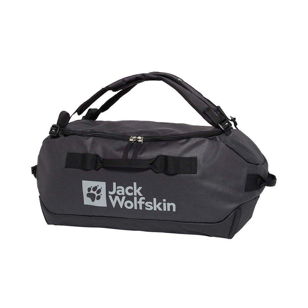 En robust, anthracitgrå rejsetaske fra Jack Wolfskin med tydeligt logo og poteemblem på fronten. Tasken har kraftige bærehåndtag, polstrede skulderstropper og en stor lynlåsåbning øverst for nem adgang. Kraftigt materiale og forstærkede syninger signalerer holdbarhed til weekendture og outdoor-eventyr. Praktiske håndtag i begge ender og en flad bund gør den stabil at placere og nem at pakke.