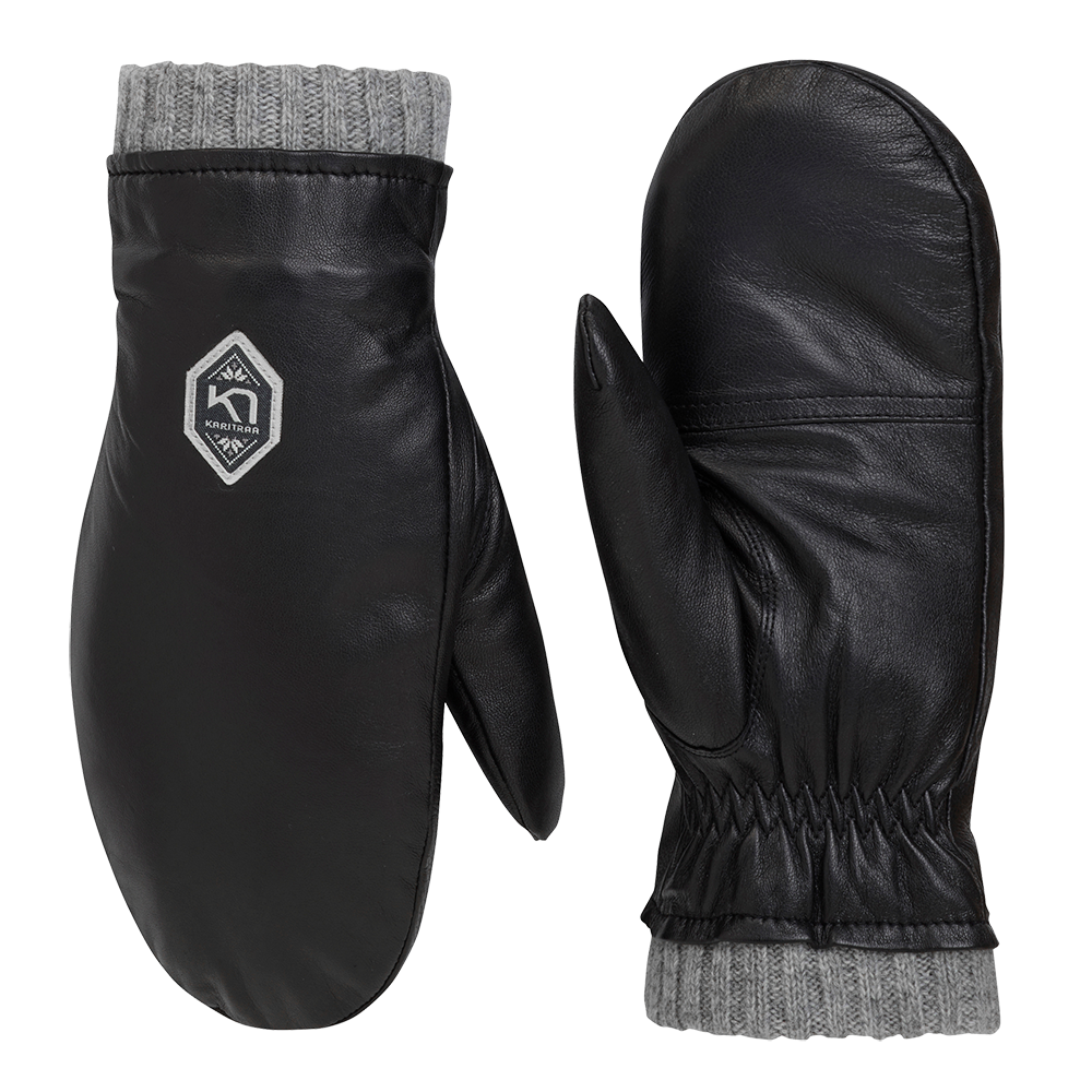 Et par sorte lædervotter med grå strikkede manchetter. Vottens glatte, matte skind fremstår elegante og tidløse; en elastisk indsnøring ved håndleddet sikrer tæt pasform. På oversiden sidder et diskret logo i kontrastfarve. Votterne kombinerer robust læder og blød strik langs åbningen, hvilket giver varme og komfort til kølige vinterdage — stilrene og funktionelle til hverdagens udendørsbrug.