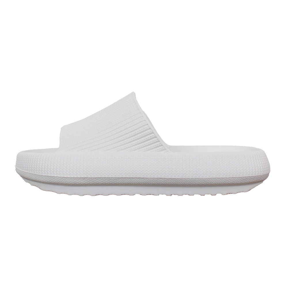 Et enkelt, hvidt badetøfledesign med en tyk, profileret sål og en bred, ribbet rem over vristen. Skoen har en ensfarvet, minimalistisk æstetik og ser ud til at være lavet af blødt, formstøbt skum, der giver dæmpning og støtte. Den grove bund giver grip, mens den glatte overflade gør den let at rengøre — ideel til både indendørs afslapning og hurtige ærinder.