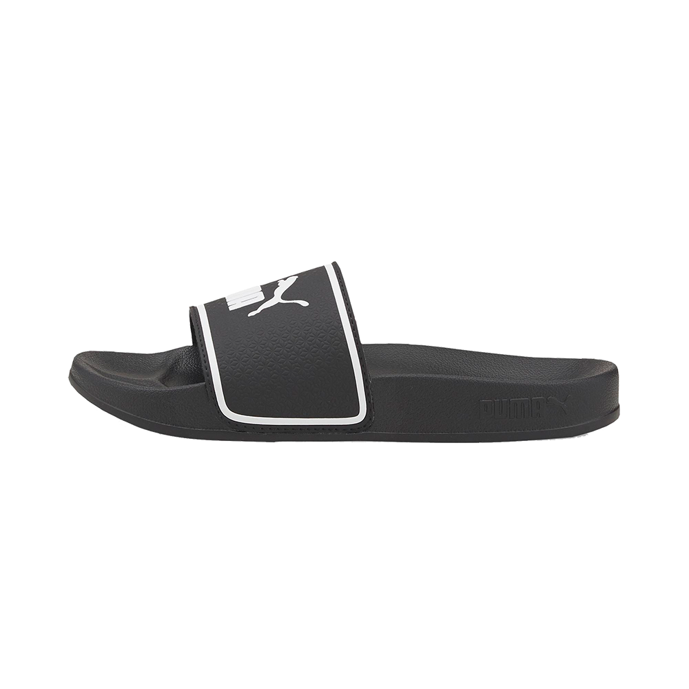 Analysis: The image shows a single black Puma slide sandal photographed from the side on a white background.
Et sort Puma-badesandale i slidstærkt syntetisk materiale med en bred, polstret rem prydet af det hvide Puma-logo og en hvid kant. Sålen er formet for komfort med tekstureret fodseng og let buestøtte, hvilket giver god stødabsorbering til hverdag eller strandbrug. Sandalen udstråler et enkelt, sporty design der kombinerer funktionalitet og stil.