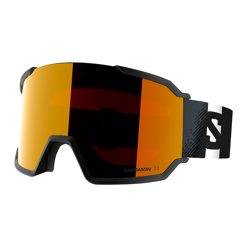 Et par moderne skibriller med stor spejllinse i varm orange, der giver et bredt synsfelt og reducerer blænding. Den matte sorte ramme omslutter linsen tæt, mens en bred elastisk strop med kontrastlogo sikrer sikker pasform rundt om hjelmen. Indvendig blød skumpolstring ved næse og pande øger komforten, og ventilationskanter antyder anti-dug-egenskaber — velegnet til alpint skiløb og snowboard.