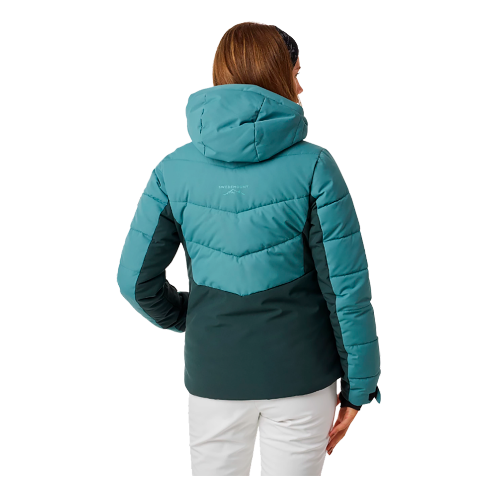 Swedemount Vail Ski Jacket W er en elegant dame skijakke designet til vinteraktiviteter. Denne model kombinerer funktionalitet og stil med sin attraktive turkise farve på den øvre del, der kontrasteres af mørkegrøn på den nedre halvdel. Jakken har en praktisk hætte og flere sikre lynlåslommer, hvilket gør den ideel til ski og udendørs eventyr. Skijakken sikrer varme og komfort under kolde forhold, mens det moderne design sikrer, at man ser godt ud på skibakkerne.