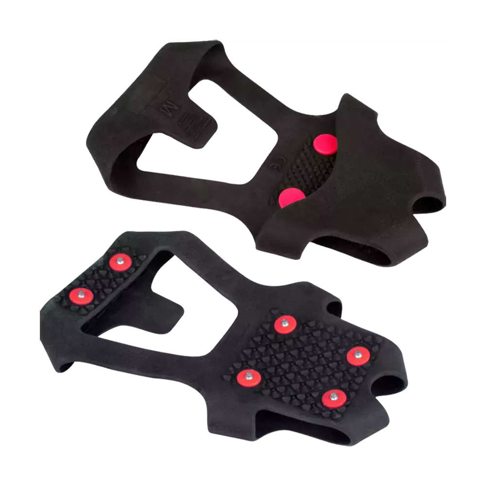 knopper. De er formet til at trækkes udenpå sko eller støvler, med åbninger til hæl og forfod for nem pasform. Undersiden har mønster og metalpigge, der øger grebet på is og sne. Produktet virker robust, let at montere og velegnet til vintervandring eller daglig pendling i glatte forhold.