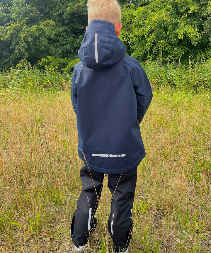 x-trail-jr-all-weather-softshell-jacket-_pant-jr-moerkeblaa-livsstil.jpg