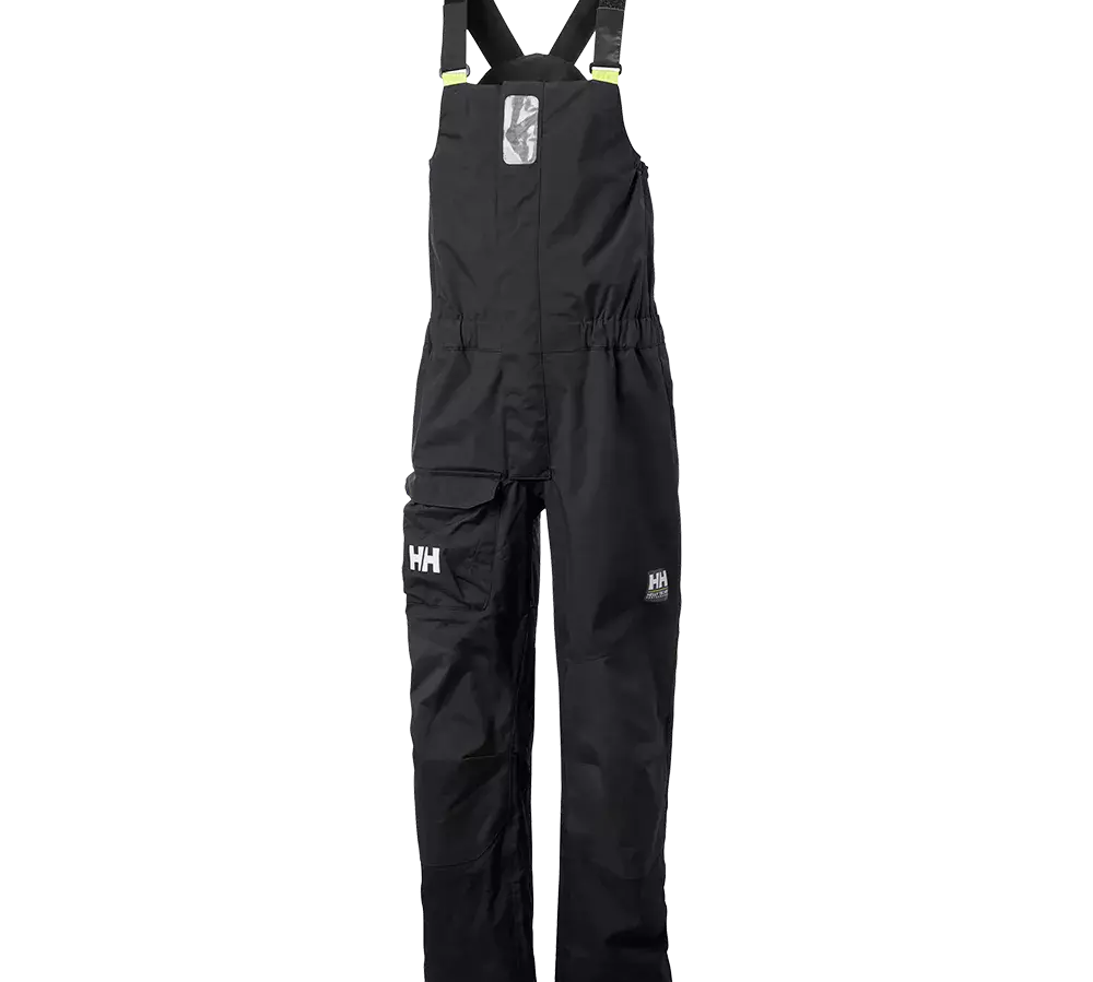 selebukser fra Helly Hansen med justerbare skulderstropper, indbygget refleks på brystet og små gule detaljer ved stropperne. Bukserne har elastisk talje, forstærkede knæ, en stor sidelomme med klap og HH-logo på benet. Funktionel og robust beklædning designet til sejlads eller krævende udendørsarbejde, vandtæt og slidstærk finish. Med flere praktiske lommer og forstærkede syninger for lang holdbarhed.