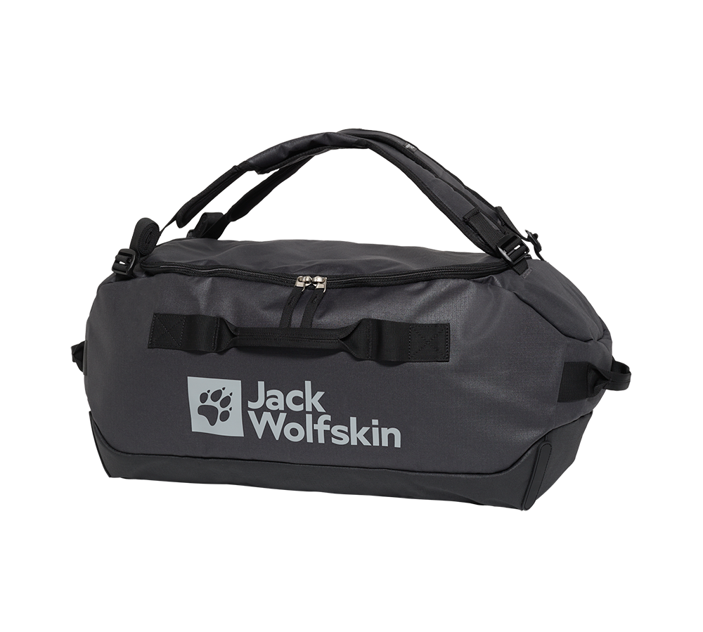 En robust, anthracitgrå rejsetaske fra Jack Wolfskin med tydeligt logo og poteemblem på fronten. Tasken har kraftige bærehåndtag, polstrede skulderstropper og en stor lynlåsåbning øverst for nem adgang. Kraftigt materiale og forstærkede syninger signalerer holdbarhed til weekendture og outdoor-eventyr. Praktiske håndtag i begge ender og en flad bund gør den stabil at placere og nem at pakke.