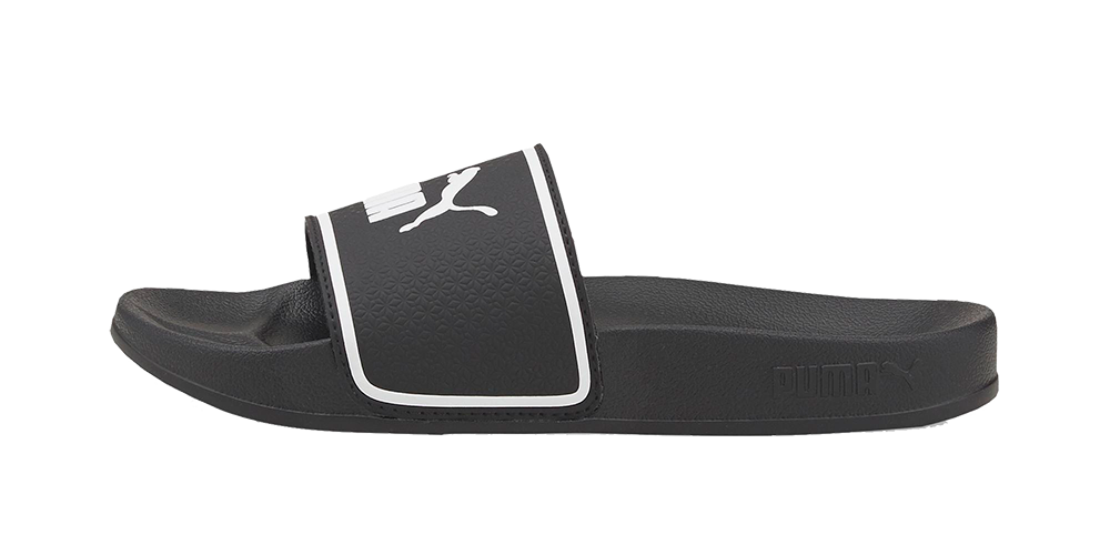 Analysis: The image shows a single black Puma slide sandal photographed from the side on a white background.

Et sort Puma-badesandale i slidstærkt syntetisk materiale med en bred, polstret rem prydet af det hvide Puma-logo og en hvid kant. Sålen er formet for komfort med tekstureret fodseng og let buestøtte, hvilket giver god stødabsorbering til hverdag eller strandbrug. Sandalen udstråler et enkelt, sporty design der kombinerer funktionalitet og stil.