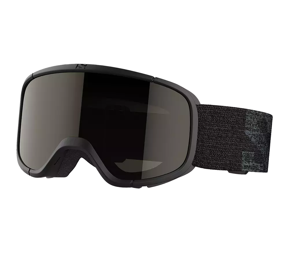 Disse skibriller har et stilrent, mat sort stel og et stort, buet spejllignende glas, der beskytter mod blænding og UV-stråler. Indvendigt sidder blød skumforing for komfort og anti-dug-effekt. Elastisk, justerbart bånd med diskret mønster sikrer stabil pasform over hjelm. Designet er minimalistisk og robust, velegnet til alpint skiløb eller snowboarding, hvor både funktion og æstetik er vigtige.