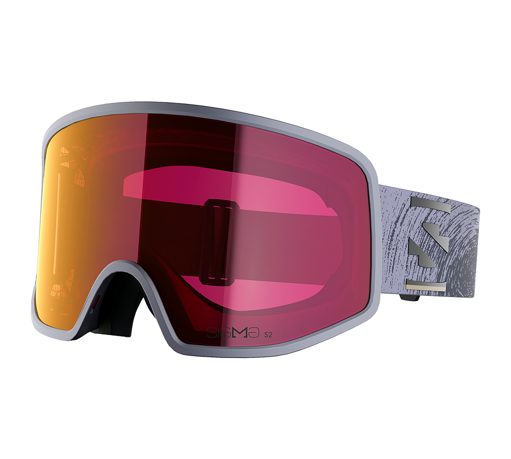 Et par moderne skibriller med bred, kurvet linse i spejleffekt, der går fra orange til pink. Den lysegrå ramme er minimalistisk og omfavner en stor, næsten kantløs front, mens det mønstrede elastikstrop med diskrete udskæringer sikrer god pasform. Indersiden har blød skumforing til komfort og tætning mod vind, velegnet til alpine forhold og intens aktivitet i sneen.